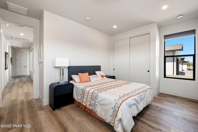 5692 E Cannon Pl, Prescott Valley, AZ 86314 - bedroom featuring wood finished floors, a closet, and recessed lighting