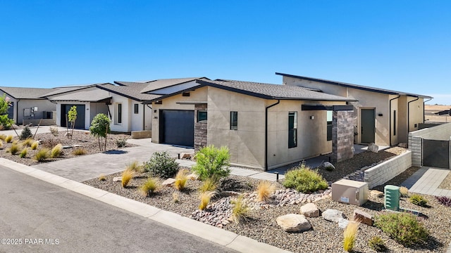 5692 E Cannon Pl, Prescott Valley, AZ 86314 - view of front of house with stucco siding, driveway, and an attached garage