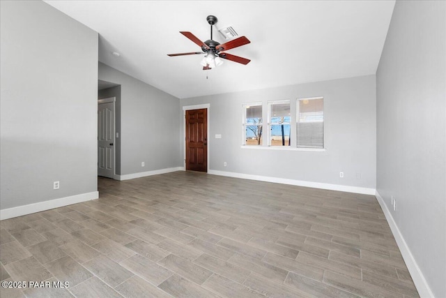 unfurnished room with vaulted ceiling and ceiling fan