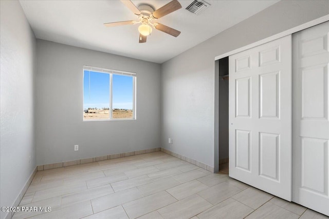 unfurnished bedroom featuring a closet and ceiling fan