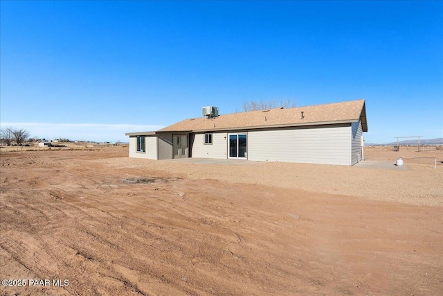 back of property featuring central air condition unit