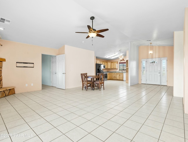 tiled living room with ceiling fan