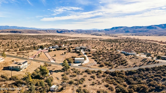 birds eye view of property with a mountain view