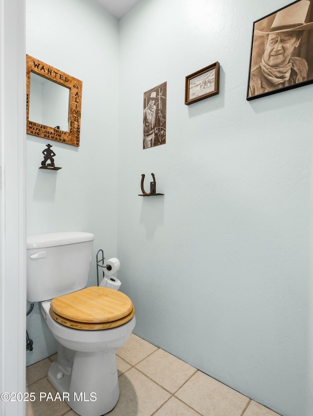 bathroom featuring tile patterned floors and toilet