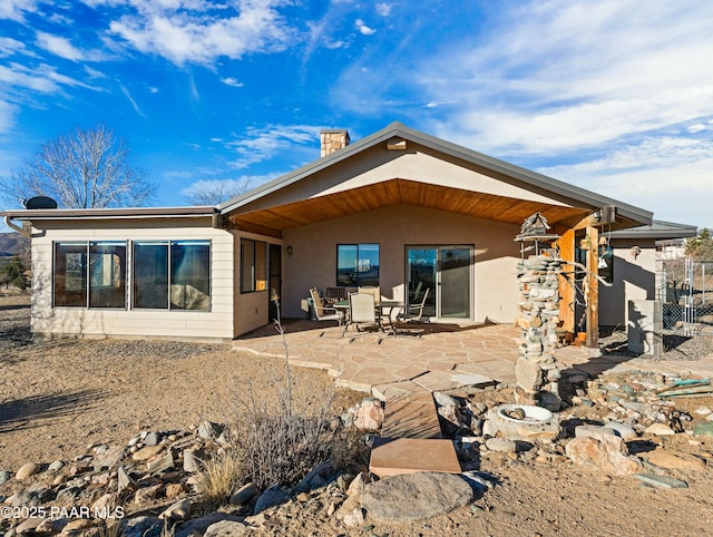 back of house with a patio area