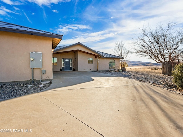 view of side of property with a mountain view