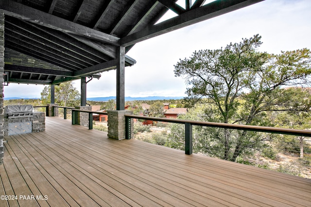 deck featuring area for grilling, a mountain view, and grilling area