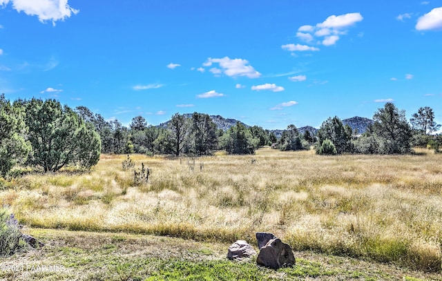 property view of mountains featuring a rural view