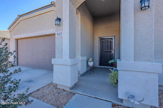 view of exterior entry featuring a garage