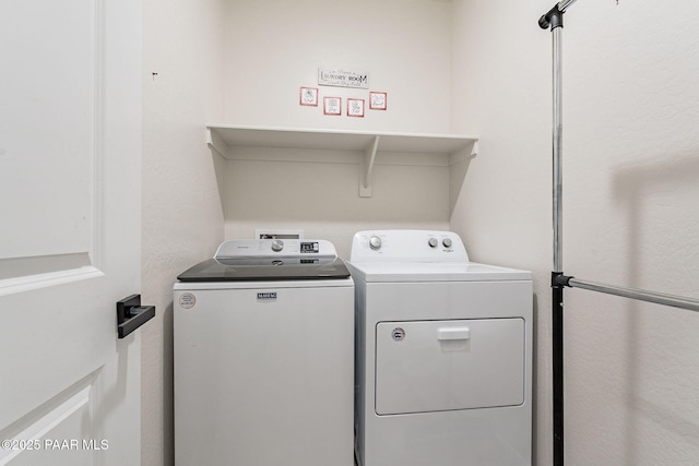 laundry room with washing machine and dryer