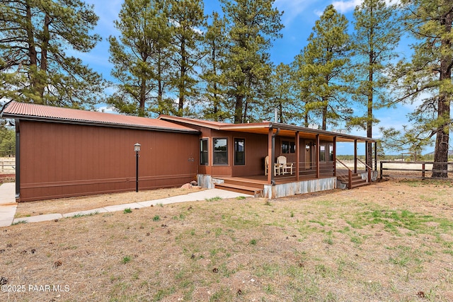 8222 N Spring Valley Rd, Parks, AZ 86018 - back of property featuring a lawn and fence