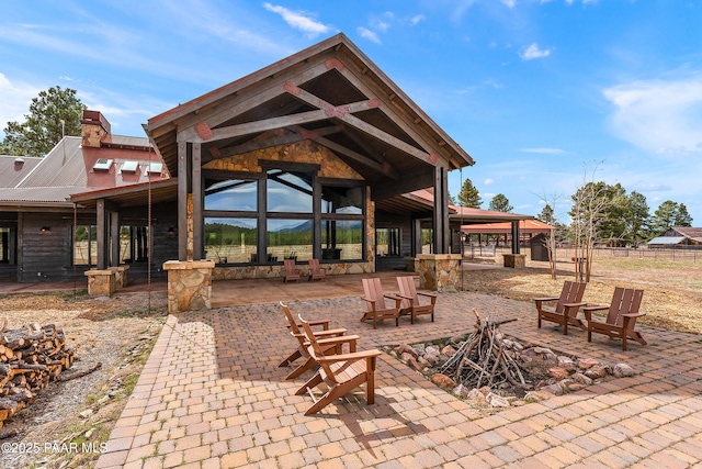 8222 N Spring Valley Rd, Parks, AZ 86018 - view of patio with a fire pit and fence