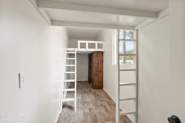 8222 N Spring Valley Rd, Parks, AZ 86018 - spacious closet featuring beam ceiling and light wood-style flooring