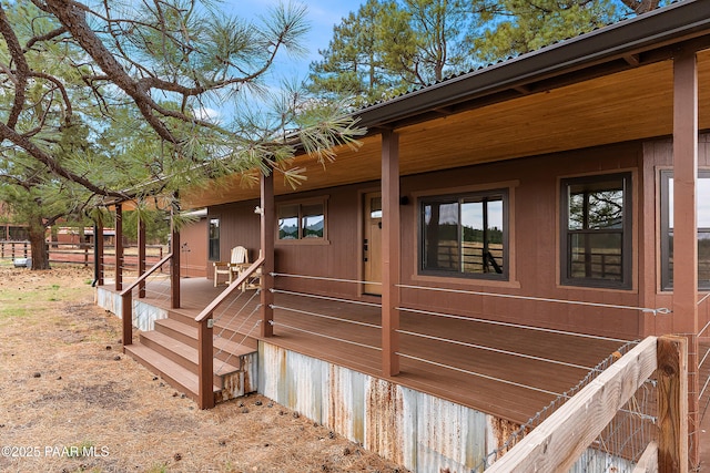 8222 N Spring Valley Rd, Parks, AZ 86018 - view of side of home featuring a porch