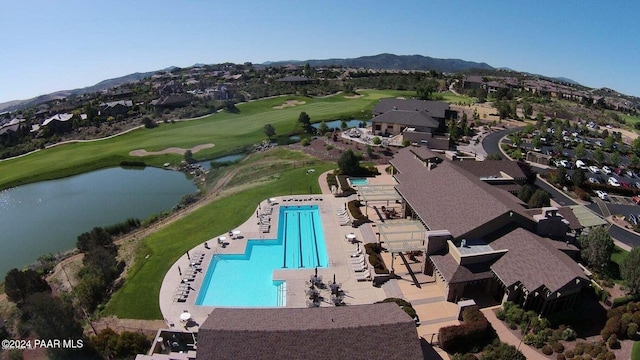 drone / aerial view with a water and mountain view