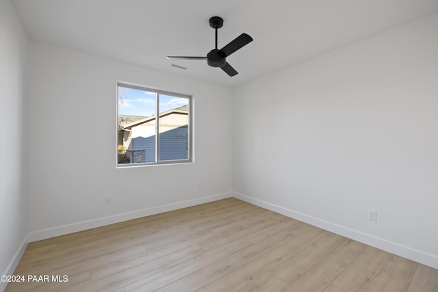 spare room featuring ceiling fan and light wood-type flooring