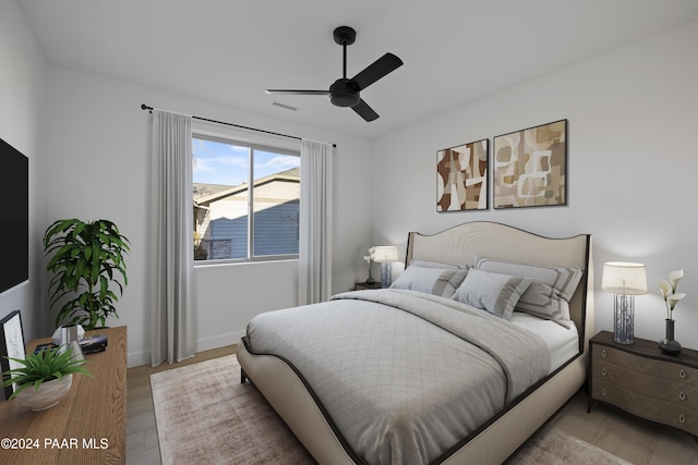 bedroom featuring light wood-type flooring and ceiling fan