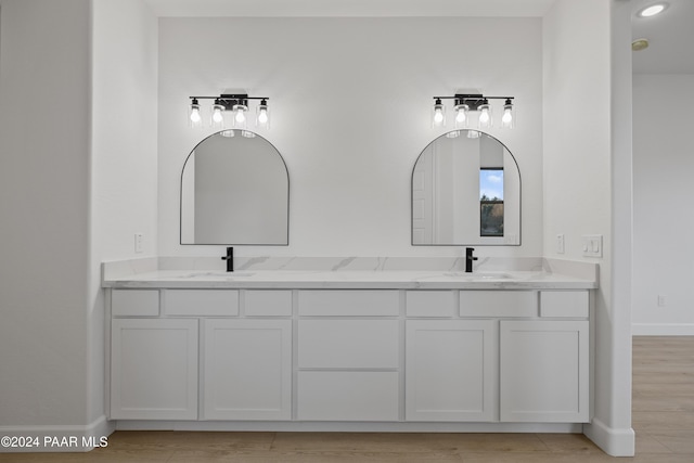 bathroom featuring hardwood / wood-style floors and vanity