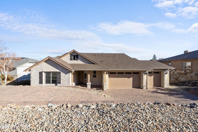 ranch-style house featuring a garage