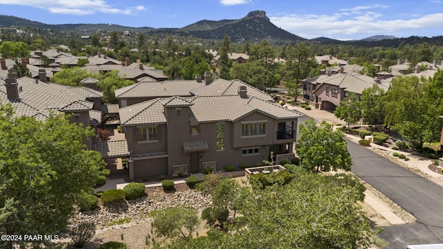 birds eye view of property with a mountain view