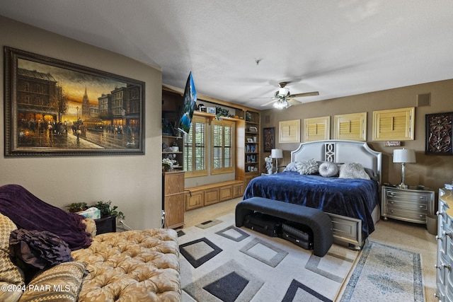 1716 Alpine Meadows Ln Unit 1105, Prescott, AZ 86303 - bedroom with ceiling fan, light colored carpet, and a textured ceiling