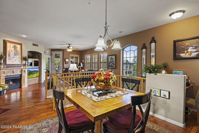 1716 Alpine Meadows Ln Unit 1105, Prescott, AZ 86303 - dining area with ceiling fan with notable chandelier and dark hardwood / wood-style floors