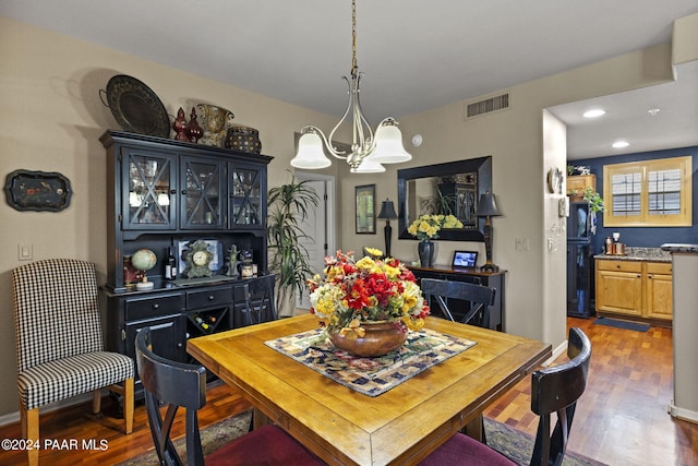 1716 Alpine Meadows Ln Unit 1105, Prescott, AZ 86303 - dining area with dark hardwood / wood-style flooring and an inviting chandelier