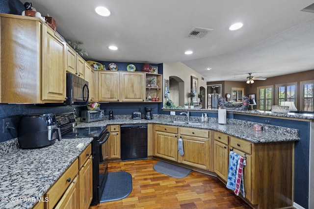 1716 Alpine Meadows Ln Unit 1105, Prescott, AZ 86303 - kitchen with light hardwood / wood-style flooring, black appliances, stone countertops, ceiling fan, and sink