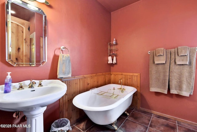 6310 N Michele Ln, Prescott, AZ 86305 - bathroom with a freestanding bath, tile patterned floors, wood walls, wainscoting, and lofted ceiling
