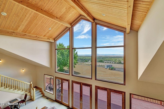 6310 N Michele Ln, Prescott, AZ 86305 - living room featuring wood ceiling with exposed beams, stairs, high vaulted ceiling, and baseboards