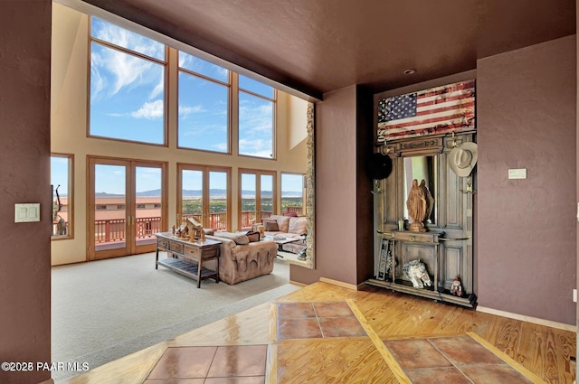 6310 N Michele Ln, Prescott, AZ 86305 - living room with baseboards, wood finished floors, and a towering ceiling