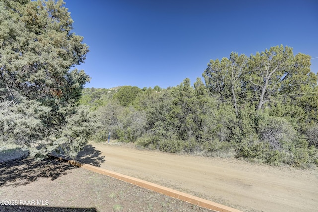 1135 N Rose Quartz Dr, Prescott, AZ 86303 - view of dirt / gravel road with a wooded view