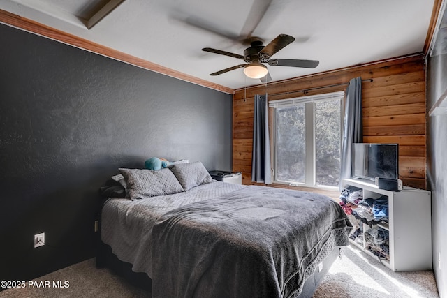 1135 N Rose Quartz Dr, Prescott, AZ 86303 - bedroom with wooden walls, carpet, ceiling fan, and a textured wall