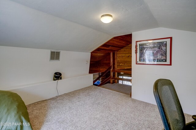 1135 N Rose Quartz Dr, Prescott, AZ 86303 - unfurnished office featuring wood walls, carpet, and lofted ceiling