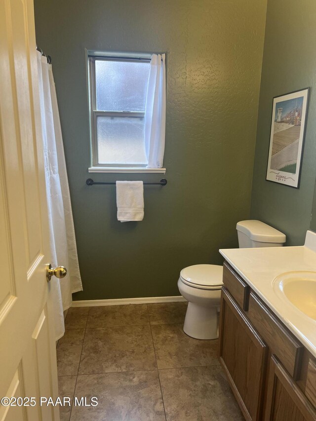 5626 N Ardmore Ave, Prescott Valley, AZ 86315 - bathroom with vanity, baseboards, tile patterned flooring, and toilet