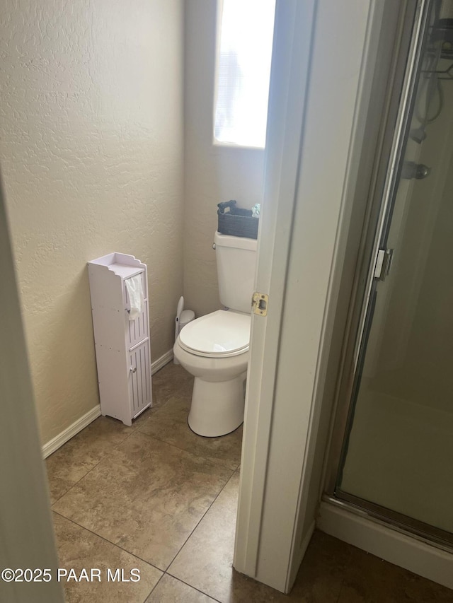 5626 N Ardmore Ave, Prescott Valley, AZ 86315 - full bath with tile patterned flooring, a textured wall, toilet, baseboards, and a shower stall