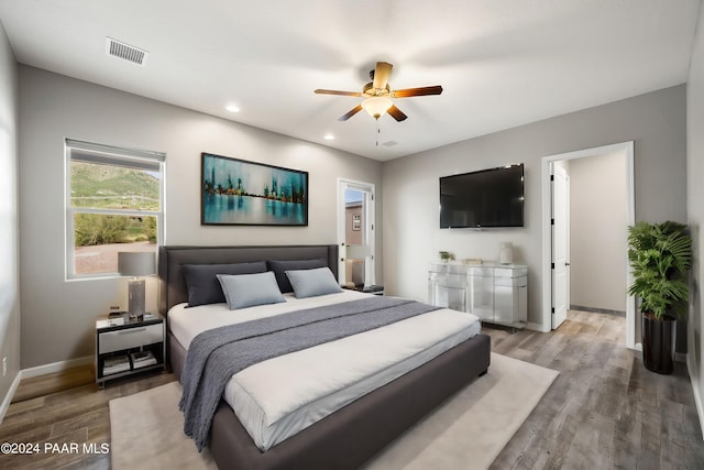 bedroom featuring ceiling fan and wood-type flooring