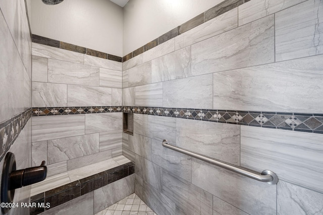 bathroom with tiled shower