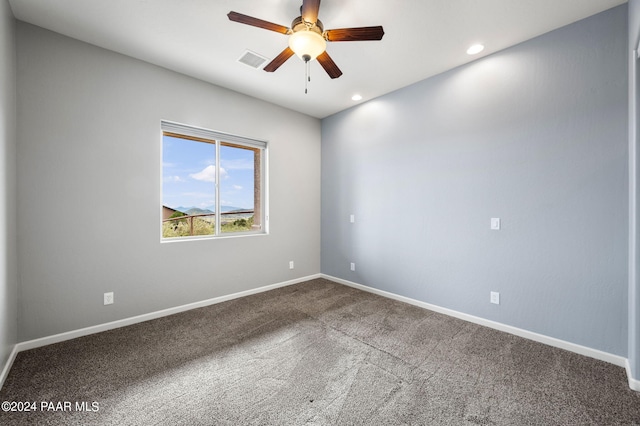 unfurnished room with carpet and ceiling fan