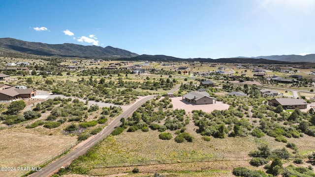 birds eye view of property with a mountain view