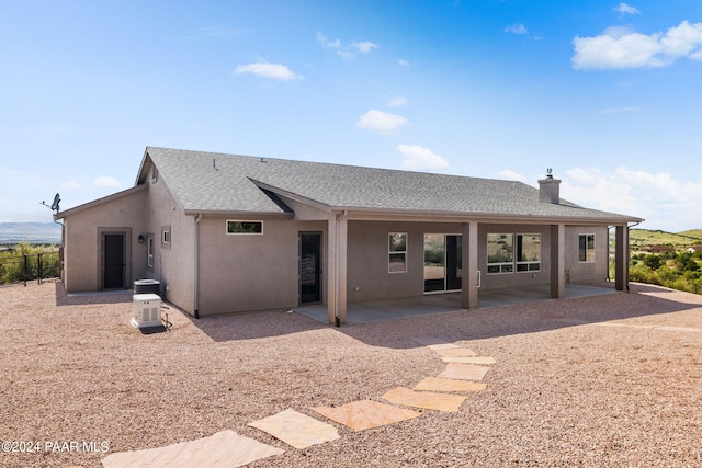 back of house with a patio