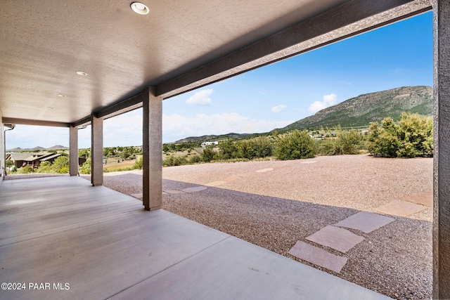 view of patio / terrace with a mountain view