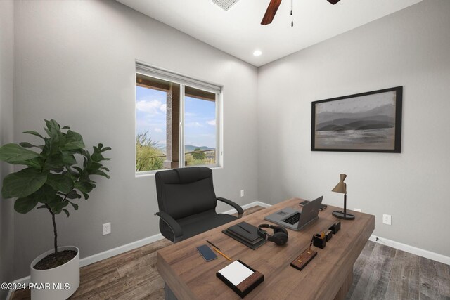 office space featuring ceiling fan and dark wood-type flooring