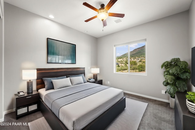 carpeted bedroom with ceiling fan