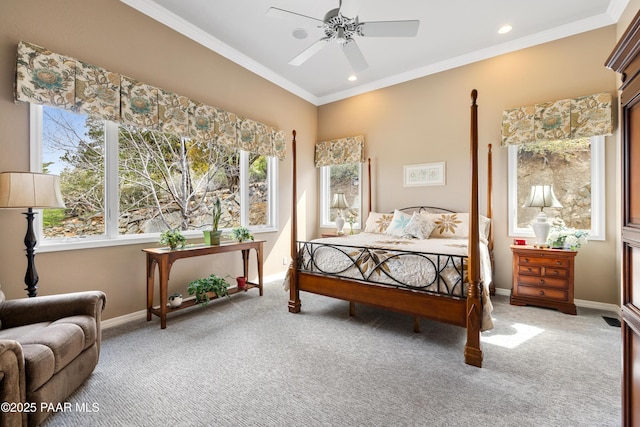 bedroom with baseboards, carpet floors, multiple windows, and crown molding