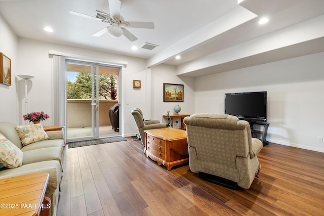 living area with ceiling fan, visible vents, recessed lighting, and wood finished floors