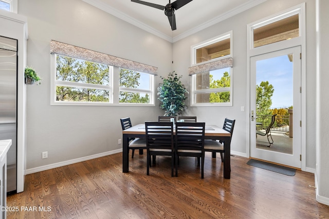 dining area featuring wood finished floors, ceiling fan, ornamental molding, and a healthy amount of sunlight