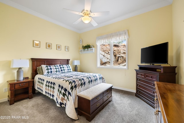 bedroom featuring baseboards, crown molding, carpet flooring, and a ceiling fan