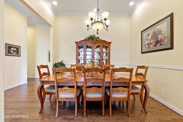 dining space with recessed lighting, an inviting chandelier, ornamental molding, baseboards, and wood finished floors