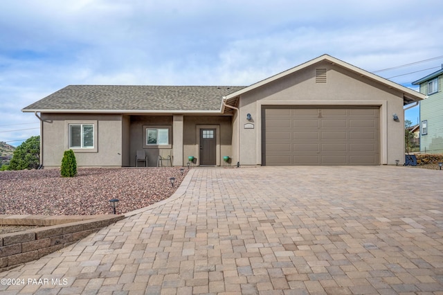 ranch-style home with a garage